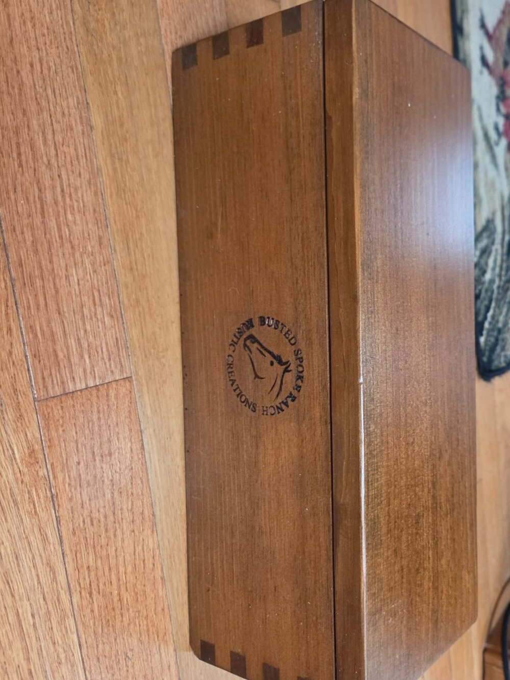 wood storage box with dovetail corners center is stamped with horse logo